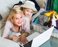 Family of two buying tickets online Royalty Free Stock Photo