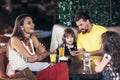 Family with two children having great time in a cafe after shop Royalty Free Stock Photo