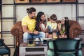 Family with two children having great time in a cafe after shop Royalty Free Stock Photo