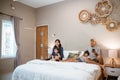 family with two children spend their time together in the bedroom Royalty Free Stock Photo