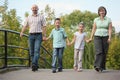 Family with two children is walking on bridge Royalty Free Stock Photo