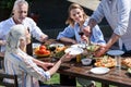 Family of two generations having outdoors picnic together Royalty Free Stock Photo