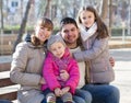 Family with two girls outdoors in sunny fall day Royalty Free Stock Photo