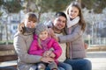 family with two girls outdoors in sunny fall day Royalty Free Stock Photo