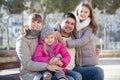 family with two girls outdoors in sunny fall day Royalty Free Stock Photo