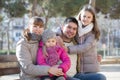 Family with two girls outdoors in sunny fall day Royalty Free Stock Photo