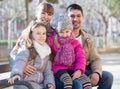 Family with two girls outdoors in sunny fall day Royalty Free Stock Photo