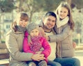 Family with two girls outdoors in sunny fall day Royalty Free Stock Photo