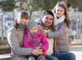 Family with two girls outdoors in sunny fall day Royalty Free Stock Photo