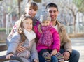 Family with two girls outdoors in sunny fall day Royalty Free Stock Photo