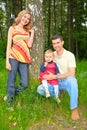 Family under a tree in park