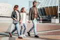 Man walking with his wife and daughter