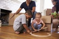 Family Unpacking Boxes In New Home On Moving Day Royalty Free Stock Photo