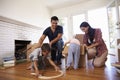 Family Unpacking Boxes In New Home On Moving Day Royalty Free Stock Photo