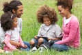 Family Using Digital Tablet Whilst Hiking In Countryside