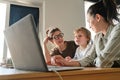 Family using laptop for online lesson