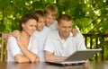 Family using laptop Royalty Free Stock Photo