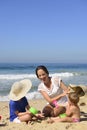Family vacation on beach: Mother and kids Royalty Free Stock Photo