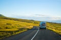 Family vacation cycle on a bus , road trip in a highway, green peaceful travel Eurotrip Iceland