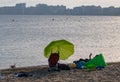 Family vacation with a dog on the sea coast at summer time