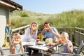Family on vacation eating outdoors Royalty Free Stock Photo