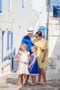 Family having fun outdoors on Mykonos streets Royalty Free Stock Photo