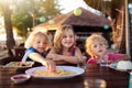 Family vacation lunch. Kids in beach restaurant