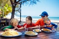 Family vacation lunch. Kids in beach restaurant