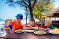 Family vacation lunch. Kids in beach restaurant