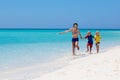 Family vacation. Parent and kids on tropical beach Royalty Free Stock Photo