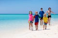 Family vacation. Parent and kids on tropical beach Royalty Free Stock Photo