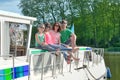 Family vacation, summer holiday travel on barge boat in canal, happy kids and parents having fun on river cruise trip in houseboat Royalty Free Stock Photo