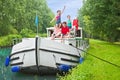 Family vacation, summer holiday travel on barge boat in canal, happy kids and parents having fun on river cruise trip in houseboat Royalty Free Stock Photo