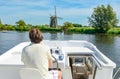 Family vacation, summer holiday travel on barge boat in canal, man by steering wheel on river cruise trip in houseboat