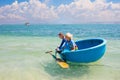 Family vacation to Vietnam. Kids in round boat Royalty Free Stock Photo