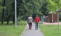 Family vacation, weekend. Happy parents and children walking in the park.