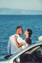 Family and valentines day. woman and man at sea near car. Love relations of couple enjoying summer day together Royalty Free Stock Photo