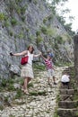 family value. happy mother with her son and daughter climbs the mountain up the steps to see the stunning view from the top of the