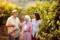 Family vineyard - Senior winemakers with daughter in vineyard