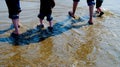 People Wading at Low Tide Royalty Free Stock Photo