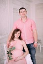 Family waiting for baby`s birth. A pregnant woman and her husband wearing white clothing Royalty Free Stock Photo