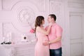 Family waiting for baby`s birth. A pregnant woman and her husband wearing white clothing Royalty Free Stock Photo