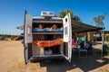 Family waking up in a campervan on the beach