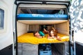 Family waking up in a campervan in the camping campsite