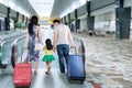 Family walk in airport hall Royalty Free Stock Photo