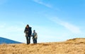 Family walk on autumn mountain plateau Royalty Free Stock Photo