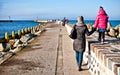 Family walk on Darlowo pier Royalty Free Stock Photo