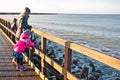 Family walk on Darlowo pier Royalty Free Stock Photo