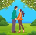 Family during walk or date in city park. Couple in love standing and holding hands in garden Royalty Free Stock Photo