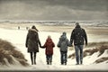 Family walking along in winter beach Royalty Free Stock Photo